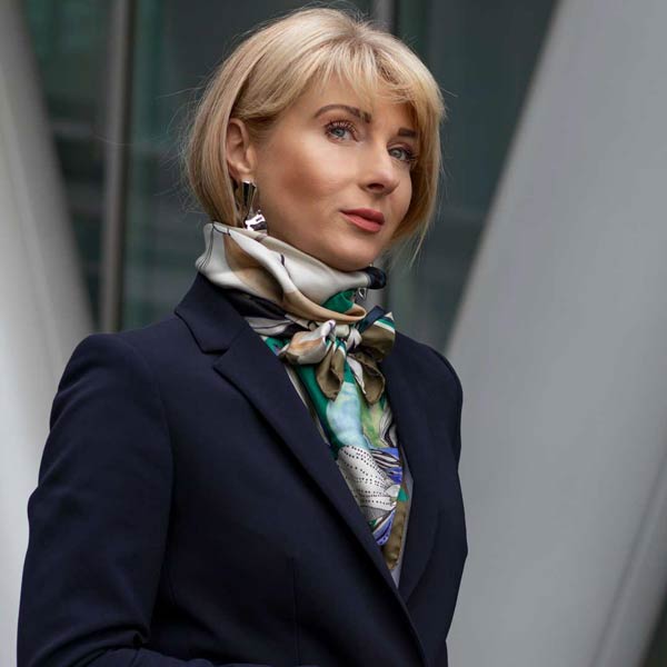 Silk square scarf tied as an ascot