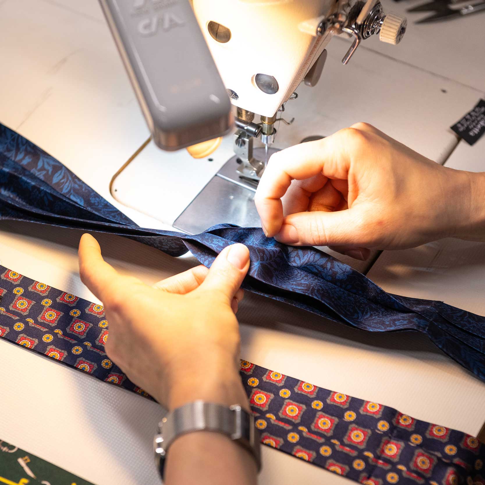 Hand sewing an Elizabetta silk ascot tie